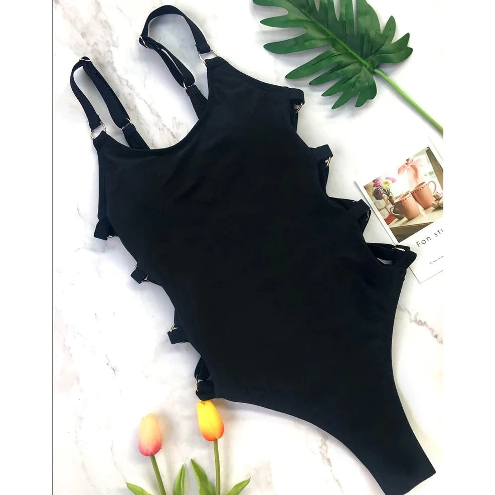 Swimming costume with cut-outs on the sides