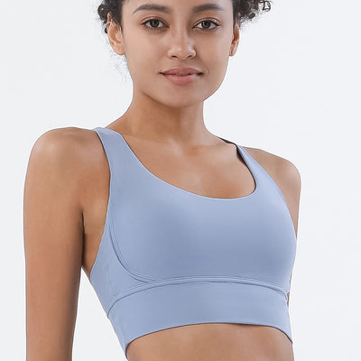 Sports bra with crossed shoulder straps