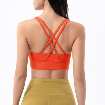 Sports bra with crossed shoulder straps