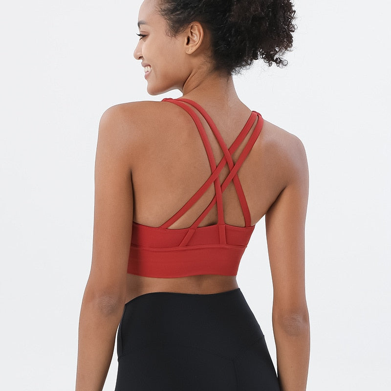 Sports bra with crossed shoulder straps