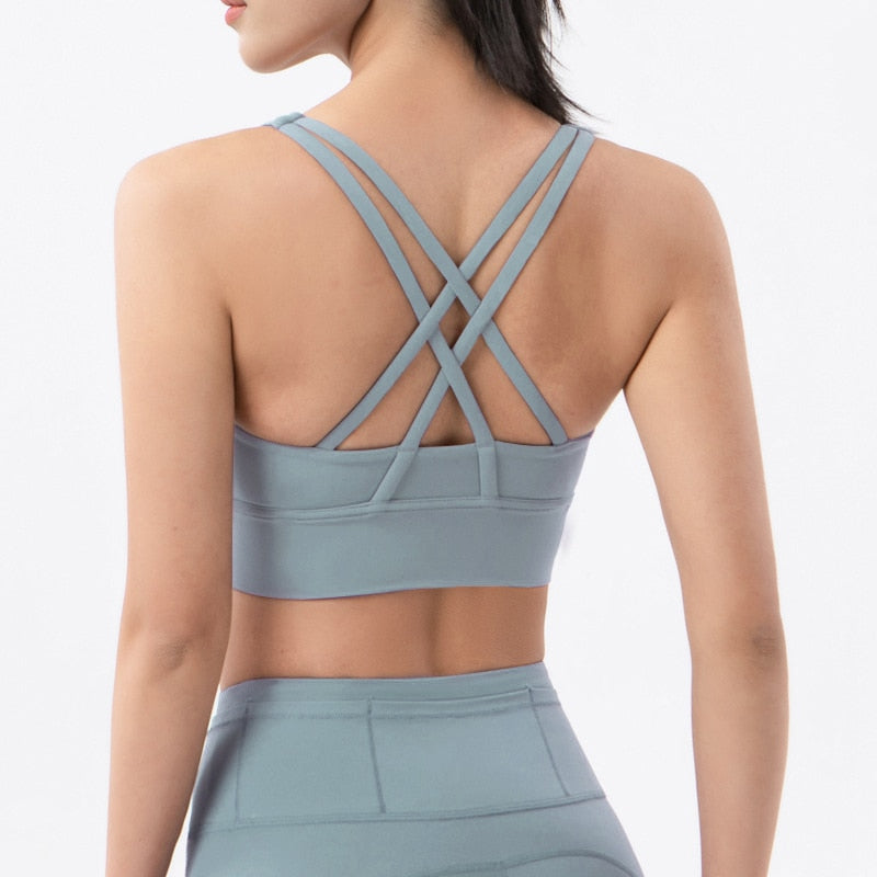 Sports bra with crossed shoulder straps