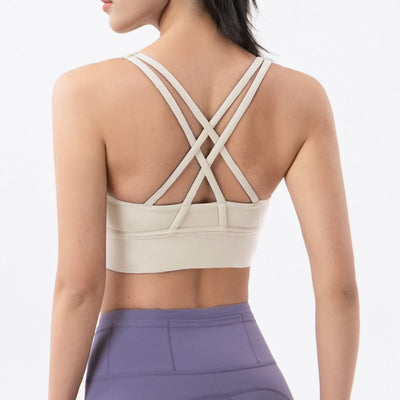 Sports bra with crossed shoulder straps