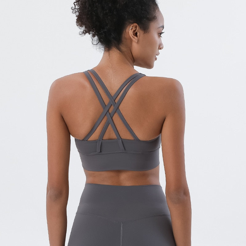 Sports bra with crossed shoulder straps