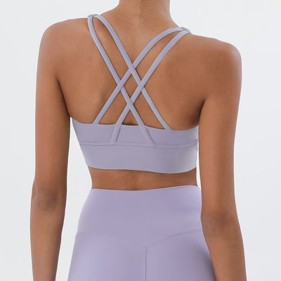 Sports bra with crossed shoulder straps