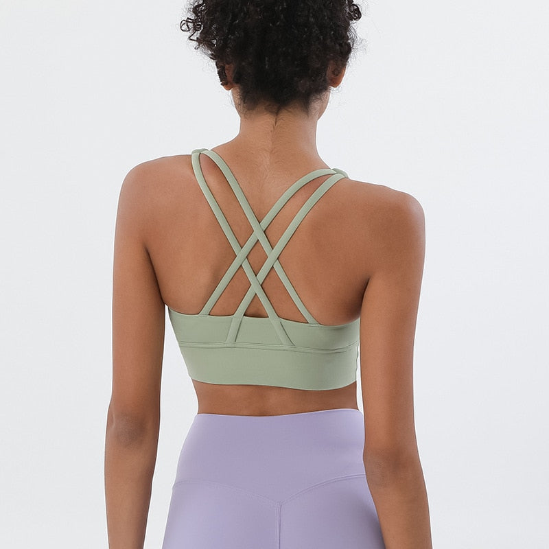 Sports bra with crossed shoulder straps