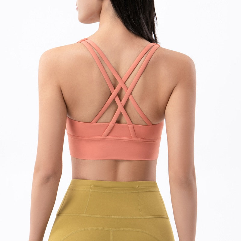 Sports bra with crossed shoulder straps