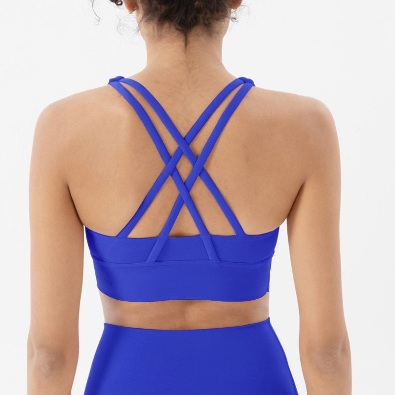 Sports bra with crossed shoulder straps